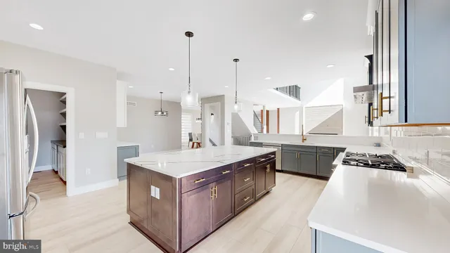 a spacious bedroom with a bed and a ceiling fan