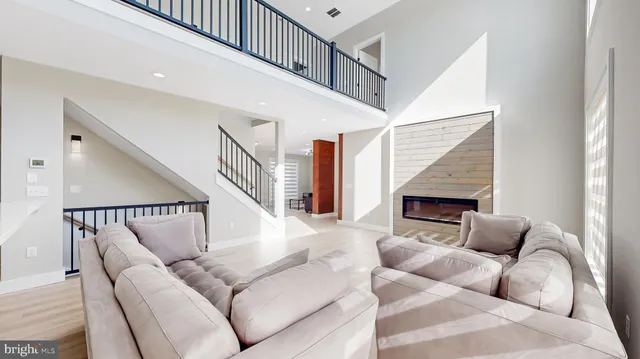 a bathroom with a white bath tub sitting next to a white sink