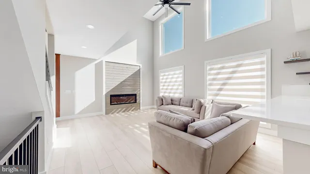 a bedroom with a bed and a ceiling fan