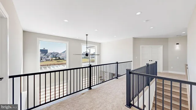 a bathroom with a sink a toilet a mirror and shower