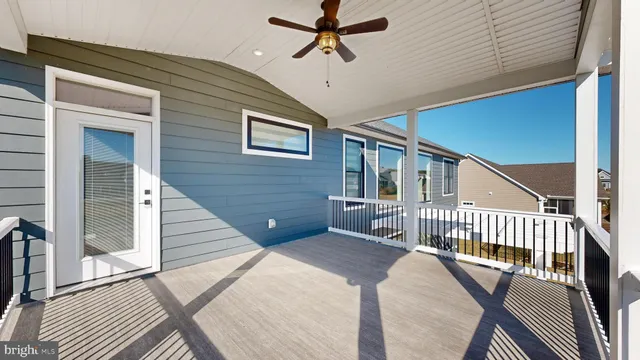 a view of a house with wooden floor and a porch