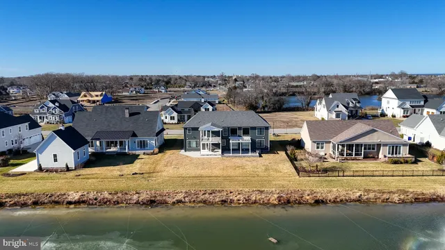 an aerial view of a house with a ocean view