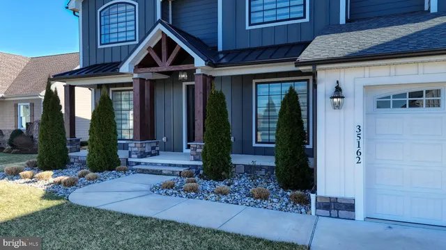 a view of a room with wooden floor and stairs