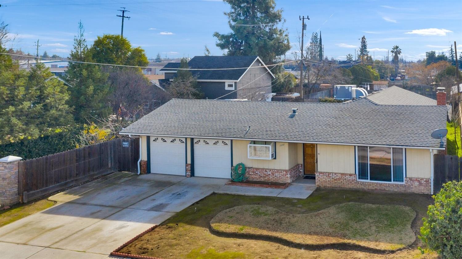 a view of a house with backyard porch and sitting area