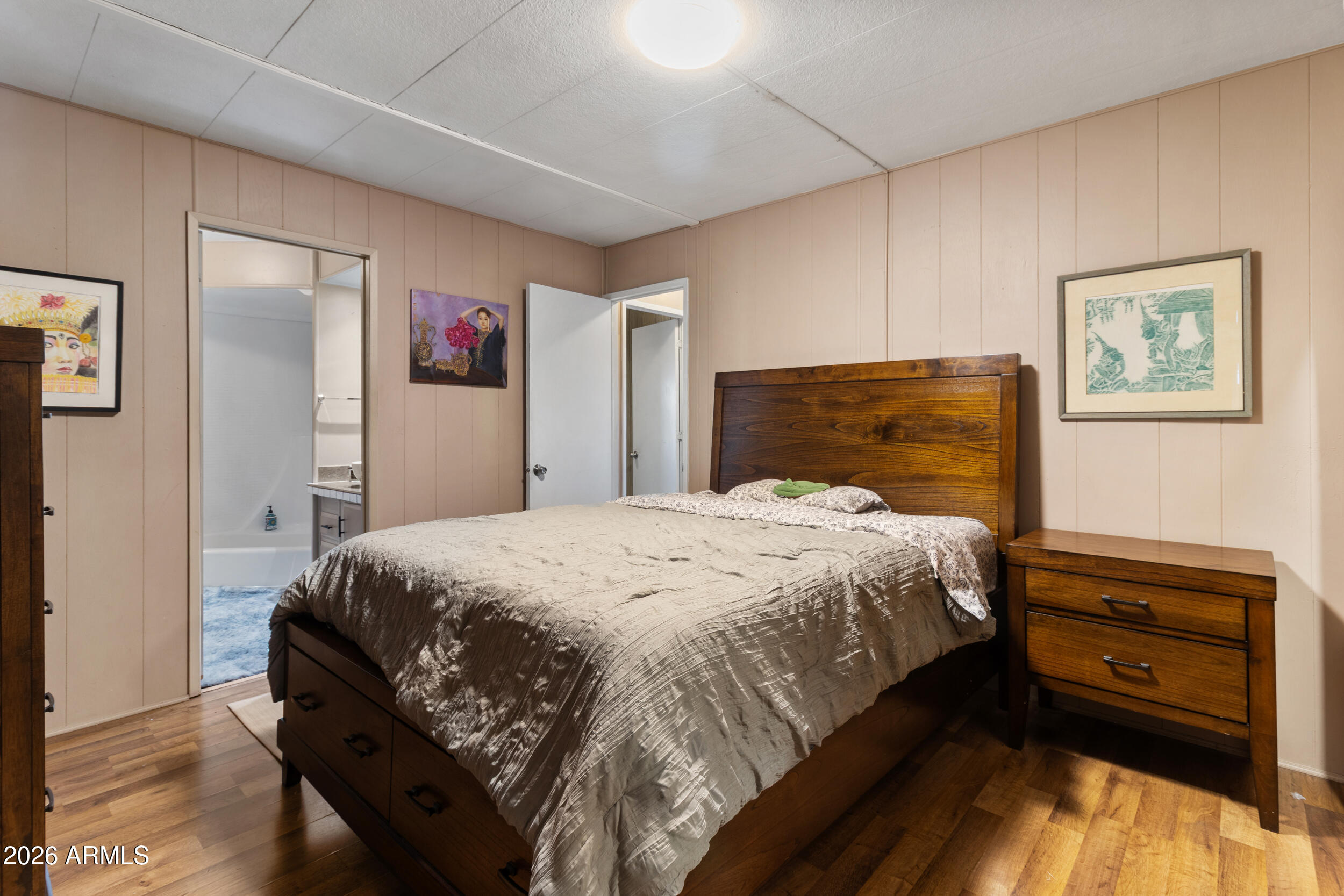 535 South Alma School Road, Unit 99 Mesa, AZ 85210 - Photo 26 of 77 a bedroom with a bed and a dresser