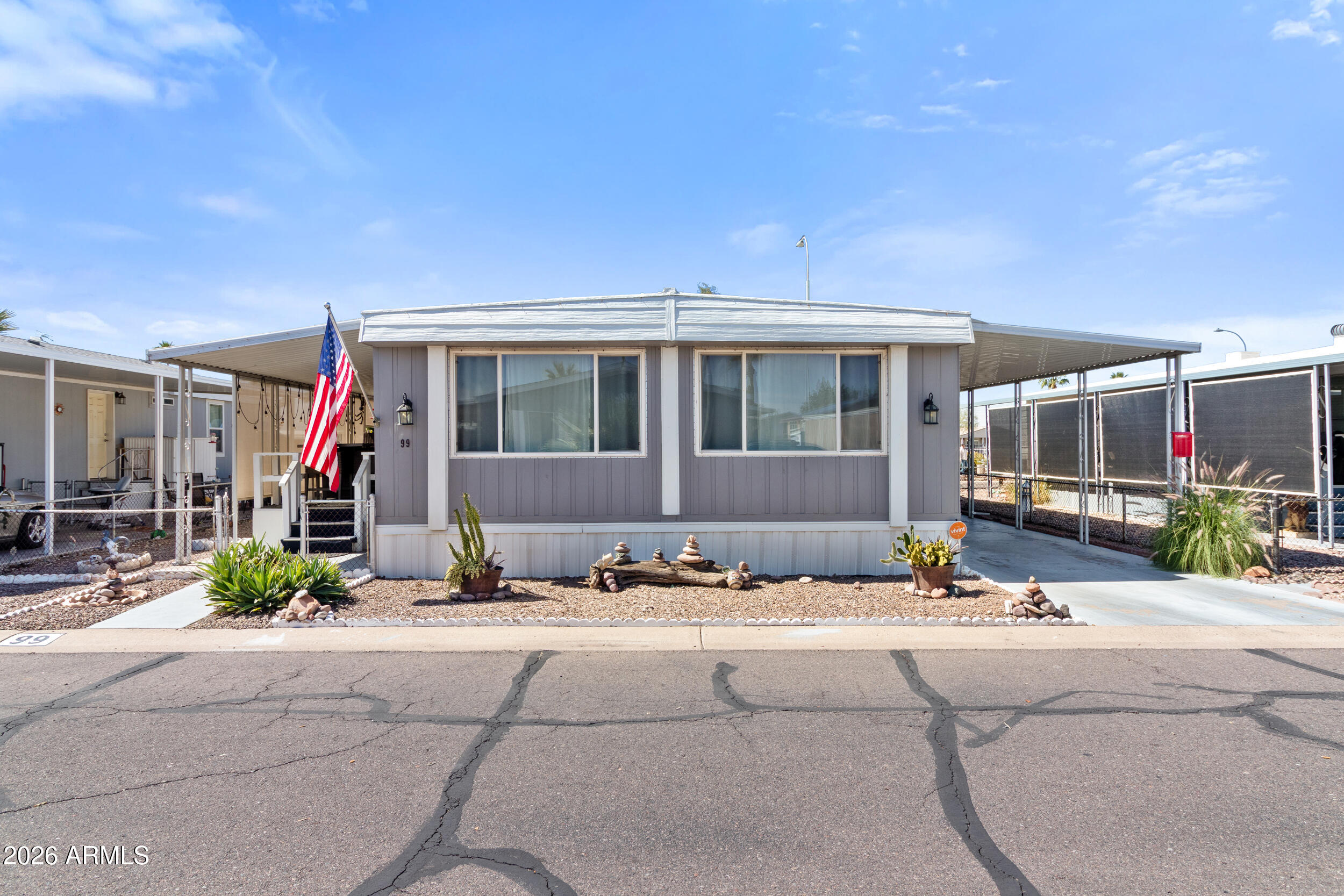 535 South Alma School Road, Unit 99 Mesa, AZ 85210 - Photo 33 of 77 a front view of a house with outdoor space and sitting area