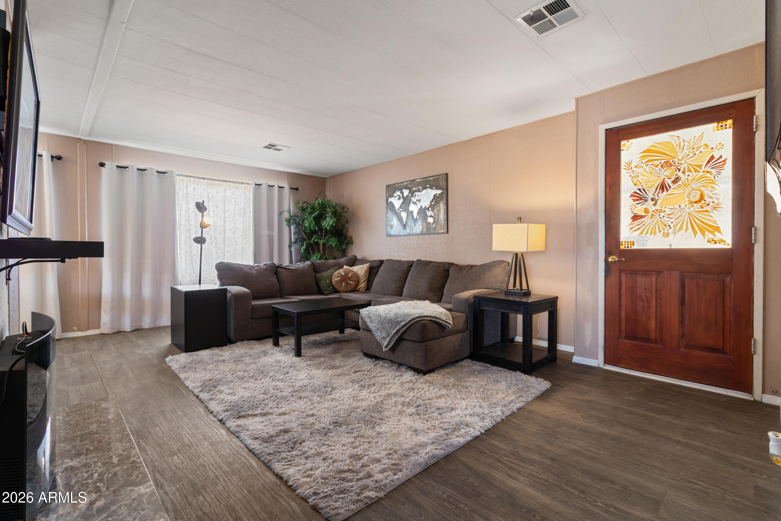 535 South Alma School Road, Unit 99 Mesa, AZ 85210 - Photo 6 of 77 a living room with furniture and a window