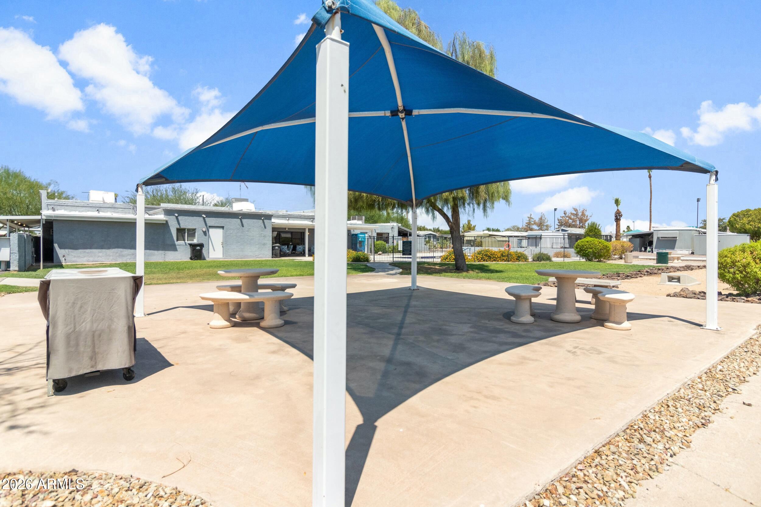 535 South Alma School Road, Unit 99 Mesa, AZ 85210 - Photo 76 of 77 a view of a swimming pool with a patio
