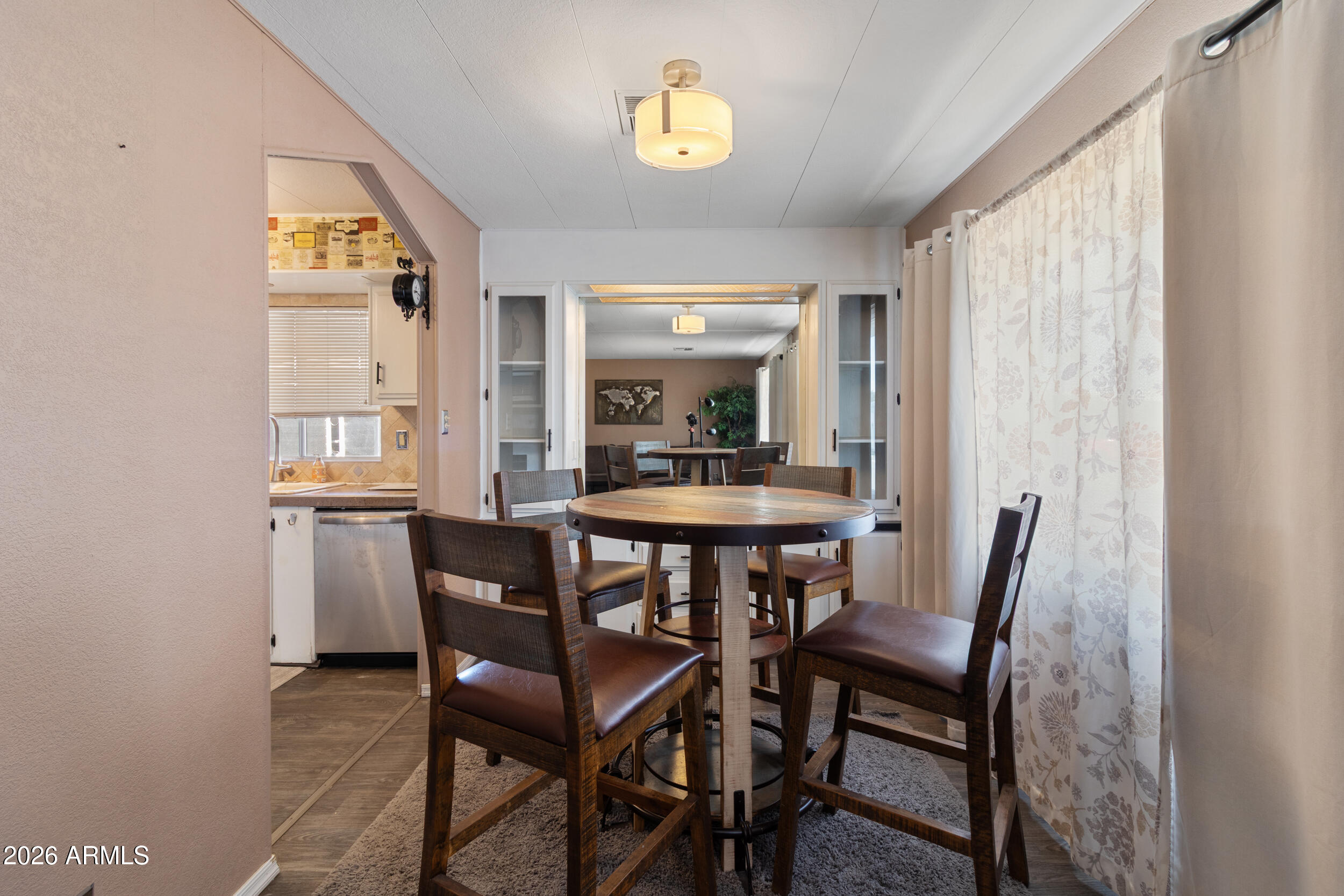 535 South Alma School Road, Unit 99 Mesa, AZ 85210 - Photo 8 of 77 a dining room with furniture and window