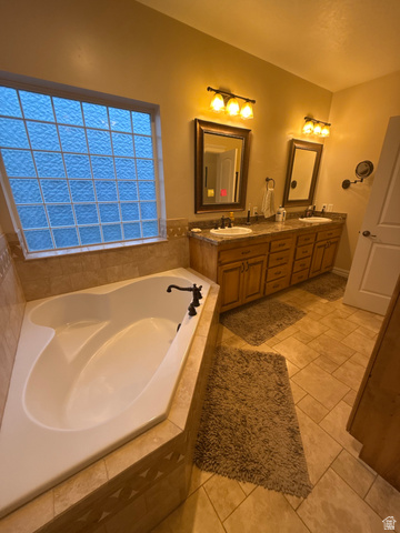 3145 South 500 West Vernal, UT 84078 - Photo 44 of 64 Bathroom featuring double vanity, a bath, and light tile patterned floors