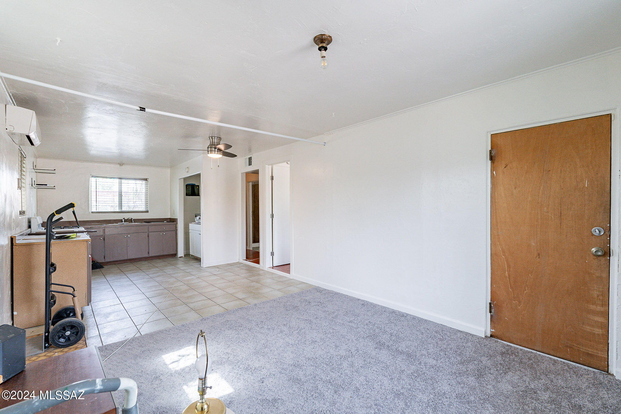 608 East Roger Road Tucson, AZ 85705 - Photo 2 of 13 a view of a kitchen with furniture and a window