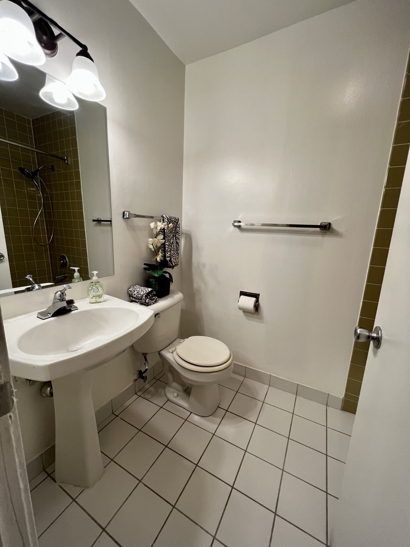 1919 Prairie Square, Unit 102 Schaumburg, IL 60173 - Photo 16 of 25 a bathroom with a sink a toilet and mirror