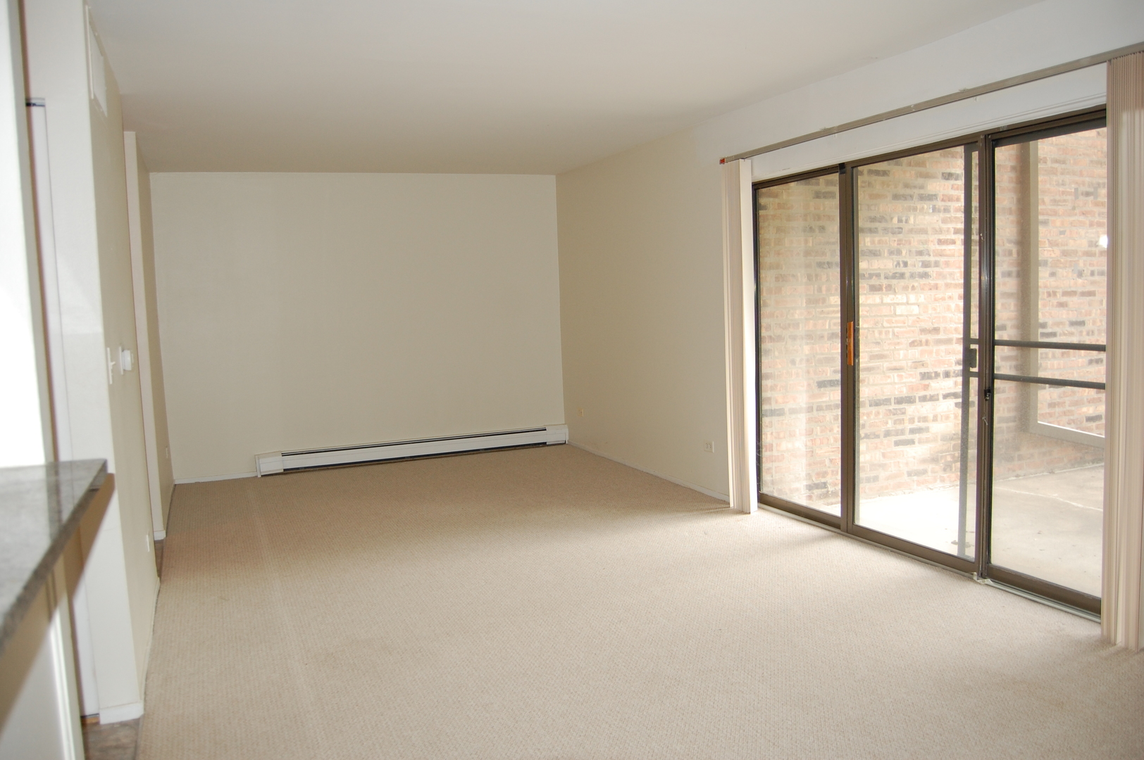 1919 Prairie Square, Unit 102 Schaumburg, IL 60173 - Photo 4 of 25 a view of an empty room with a window