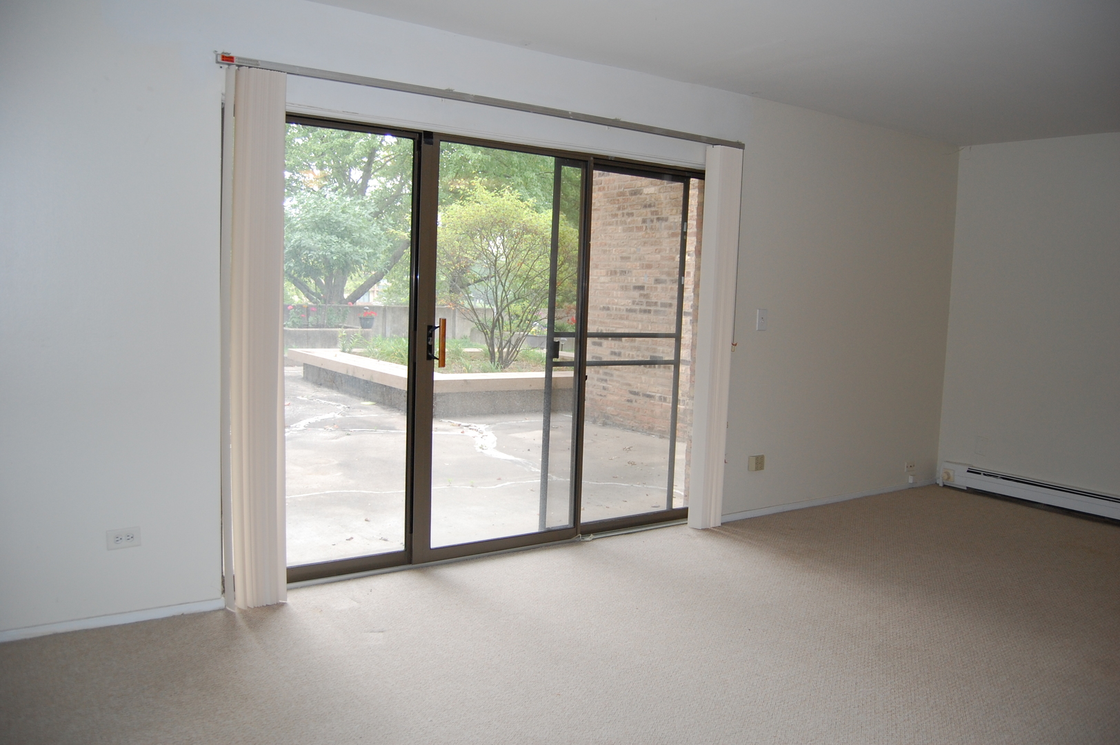 1919 Prairie Square, Unit 102 Schaumburg, IL 60173 - Photo 8 of 25 a view of empty room with floor to ceiling window