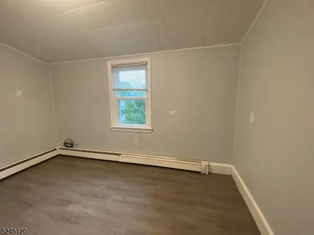 an empty room with a empty space and a window