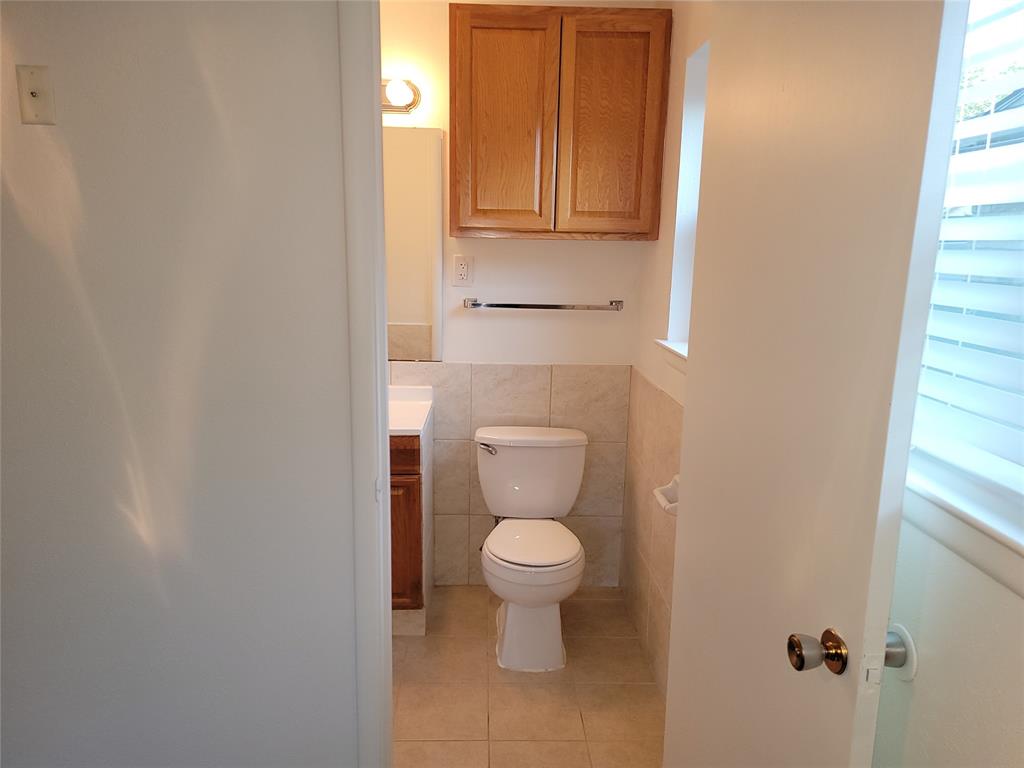 1000 Springdale Road Bedford, TX 76021 - Photo 16 of 36 Main ensuite bathroom with built-in cabinets.