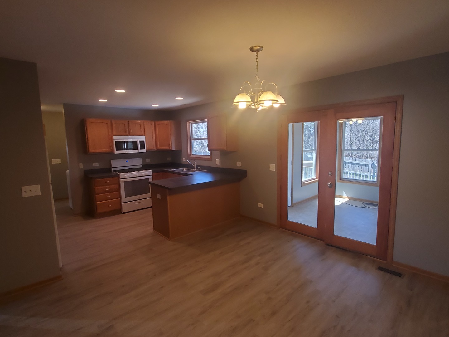 38188 North 3rd Avenue Spring Grove, IL 60081 - Photo 6 of 14 a open kitchen with stainless steel appliances granite countertop a stove and a refrigerator