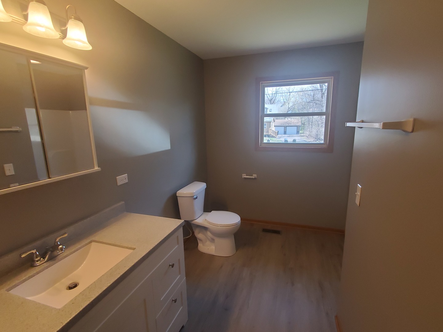 38188 North 3rd Avenue Spring Grove, IL 60081 - Photo 9 of 14 a bathroom with a granite countertop toilet and a sink