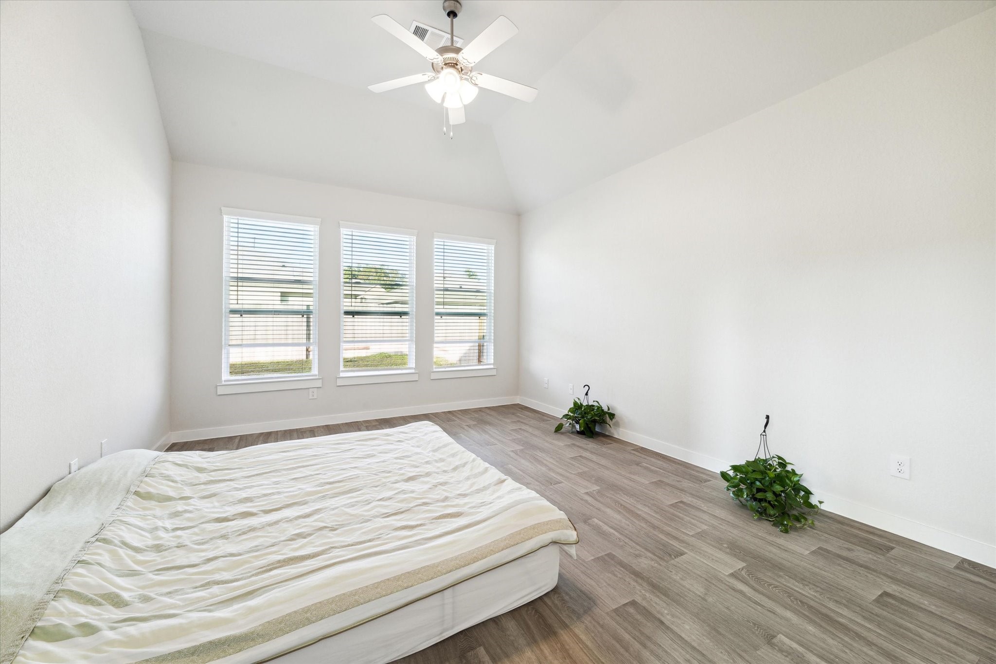 7838 Ruth Ravine Court Spring, TX 77379 - Photo 11 of 20 a bedroom with a bed chandelier and a window