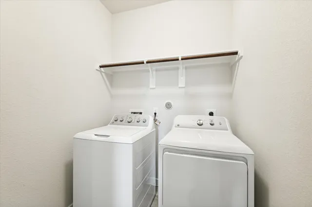 a house that is sitting in the grass