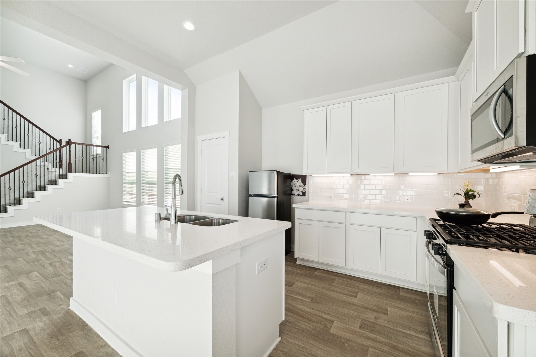 7838 Ruth Ravine Court Spring, TX 77379 - Photo 8 of 20 a kitchen with stainless steel appliances granite countertop a sink and a stove