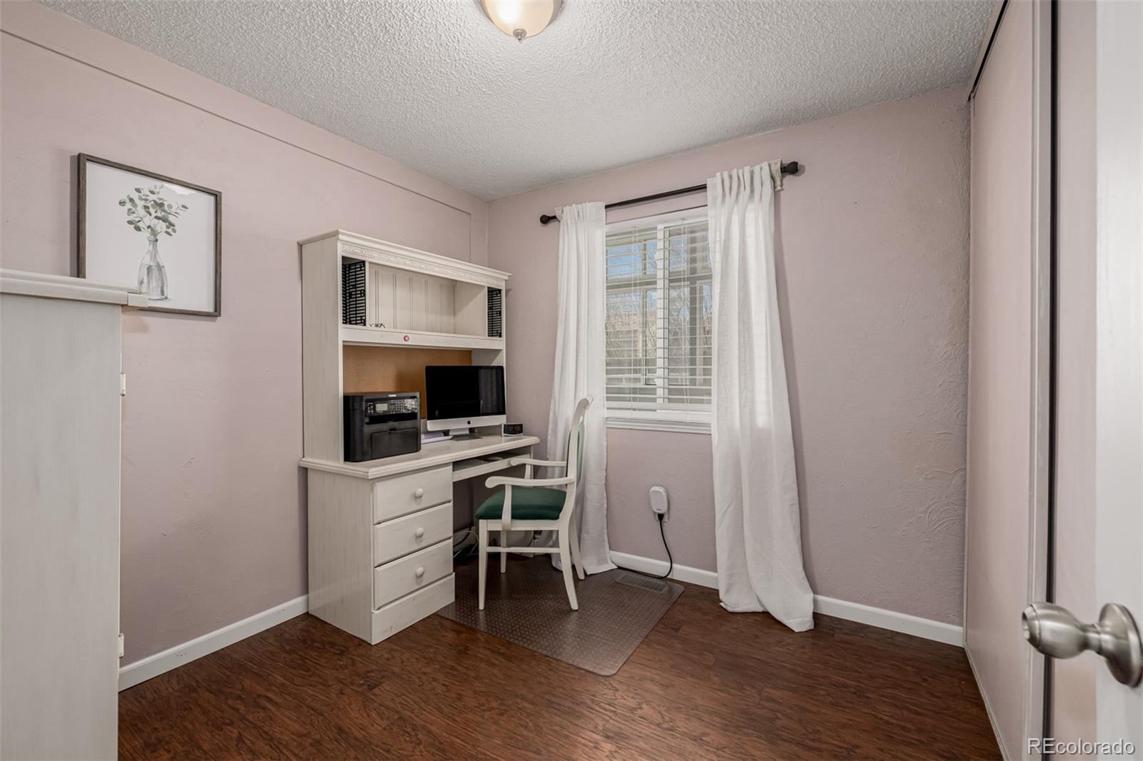 7624 Gray Way Arvada, CO 80003 - Photo 23 of 39 a workspace with wooden floor