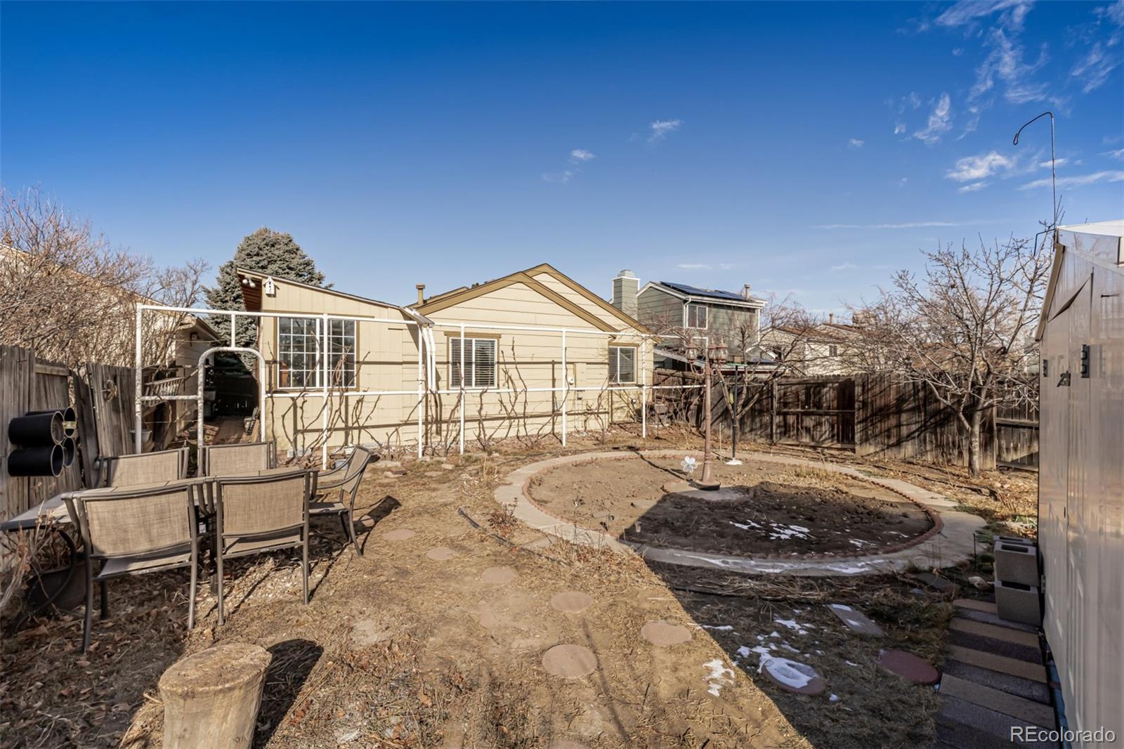 7624 Gray Way Arvada, CO 80003 - Photo 32 of 39 a view of a house with a patio