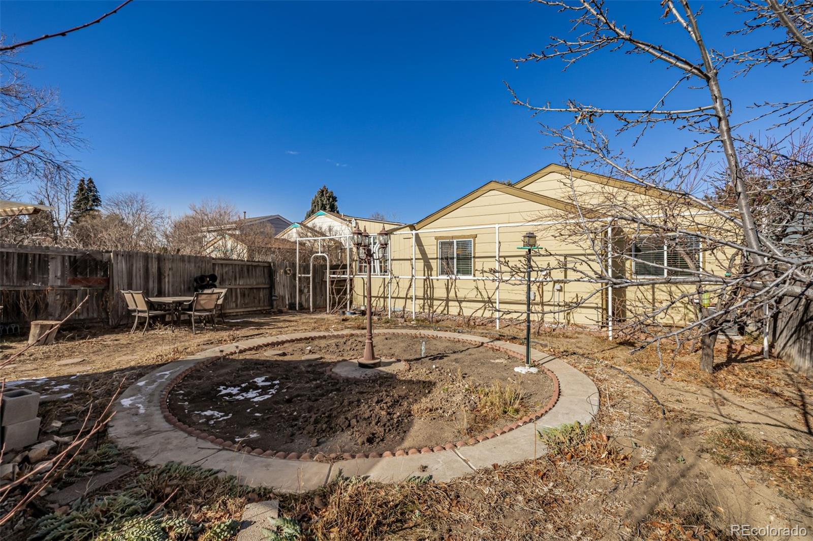 7624 Gray Way Arvada, CO 80003 - Photo 33 of 39 a view of a house with snow on the ground