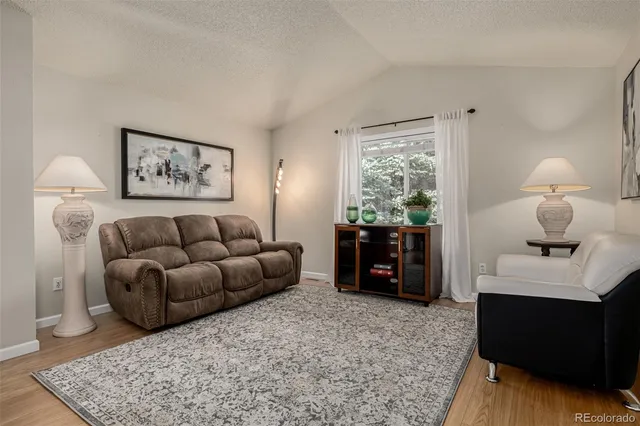 a living room with furniture and a table