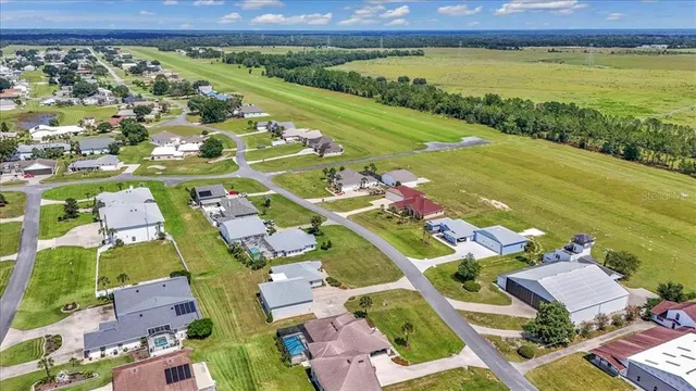 an aerial view of a city and lake view
