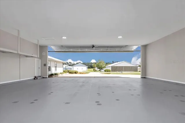 an empty room with a stove and a window
