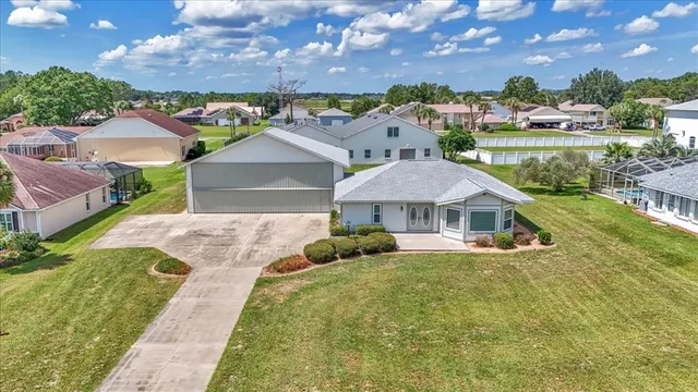 an aerial view of a house with a swimming pool