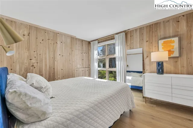 a large white bed in a white room