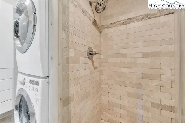 a bathroom with a shower and a mirror