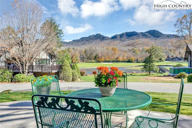 a view of a chairs and table in the patio