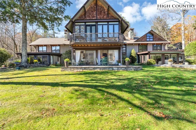 a front view of a residential apartment building with a yard