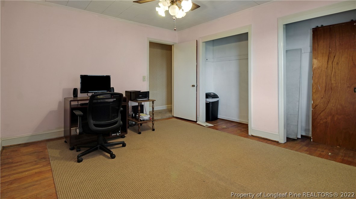 6250 Smithfield Road Wade, NC 28395 - Photo 17 of 46 a view of a workspace with furniture and a window