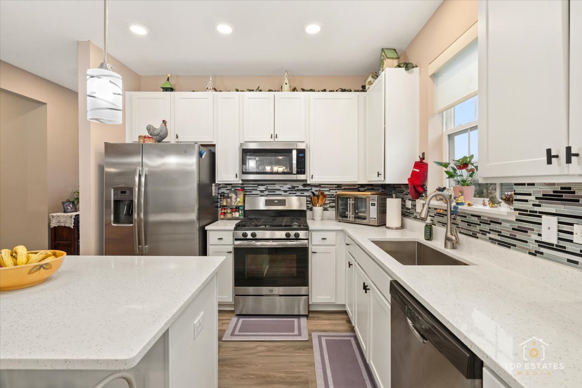 2010 Azure Lane Algonquin, IL 60102 - Photo 14 of 41 a kitchen with stainless steel appliances a sink dishwasher stove refrigerator and microwave