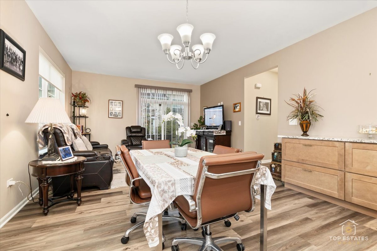 2010 Azure Lane Algonquin, IL 60102 - Photo 16 of 41 a view of a dining room with furniture and a chandelier