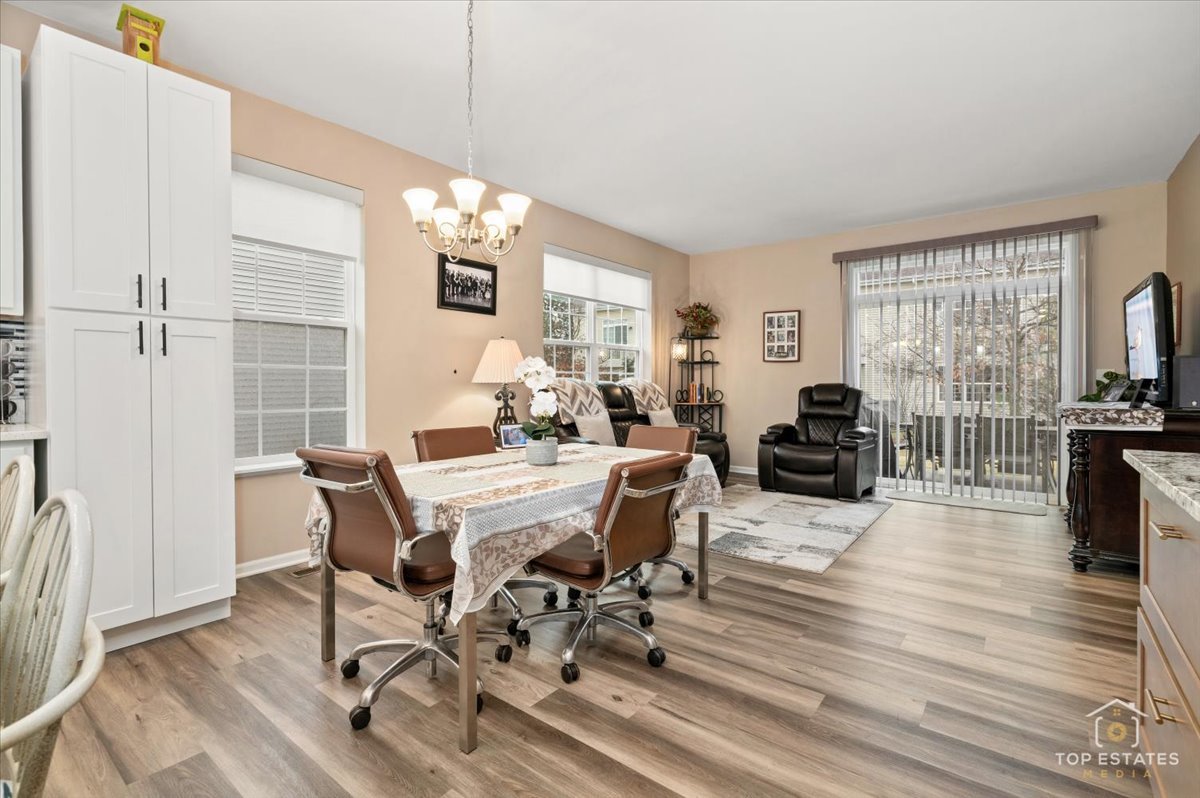 2010 Azure Lane Algonquin, IL 60102 - Photo 17 of 41 a view of a dining room with furniture window and wooden floor