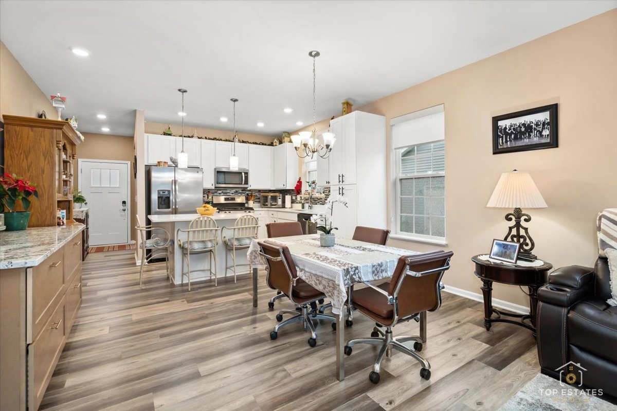 2010 Azure Lane Algonquin, IL 60102 - Photo 18 of 41 a view of a dining room with furniture window and wooden floor