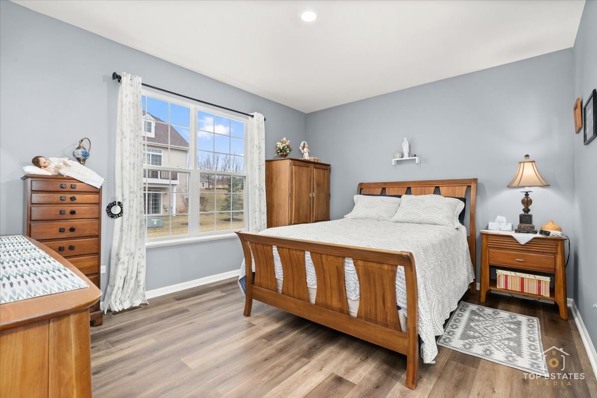 2010 Azure Lane Algonquin, IL 60102 - Photo 22 of 41 a bed sitting in a bedroom next to a window