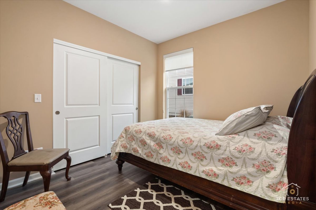 2010 Azure Lane Algonquin, IL 60102 - Photo 25 of 41 a bedroom with a bed and chair