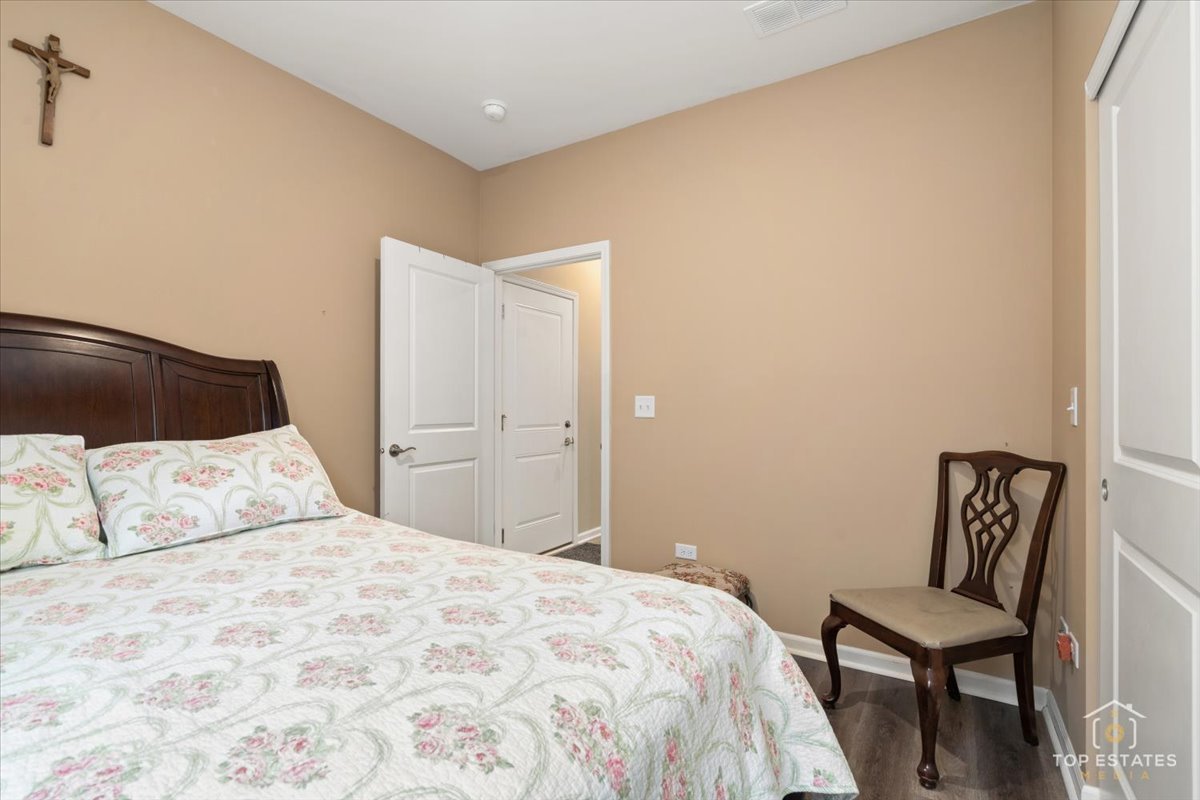 2010 Azure Lane Algonquin, IL 60102 - Photo 26 of 41 a bedroom with a bed and chair