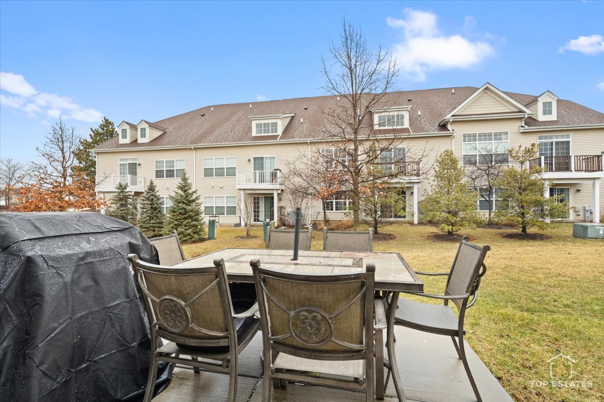 2010 Azure Lane Algonquin, IL 60102 - Photo 29 of 41 a view of a patio with table and chairs and potted plants