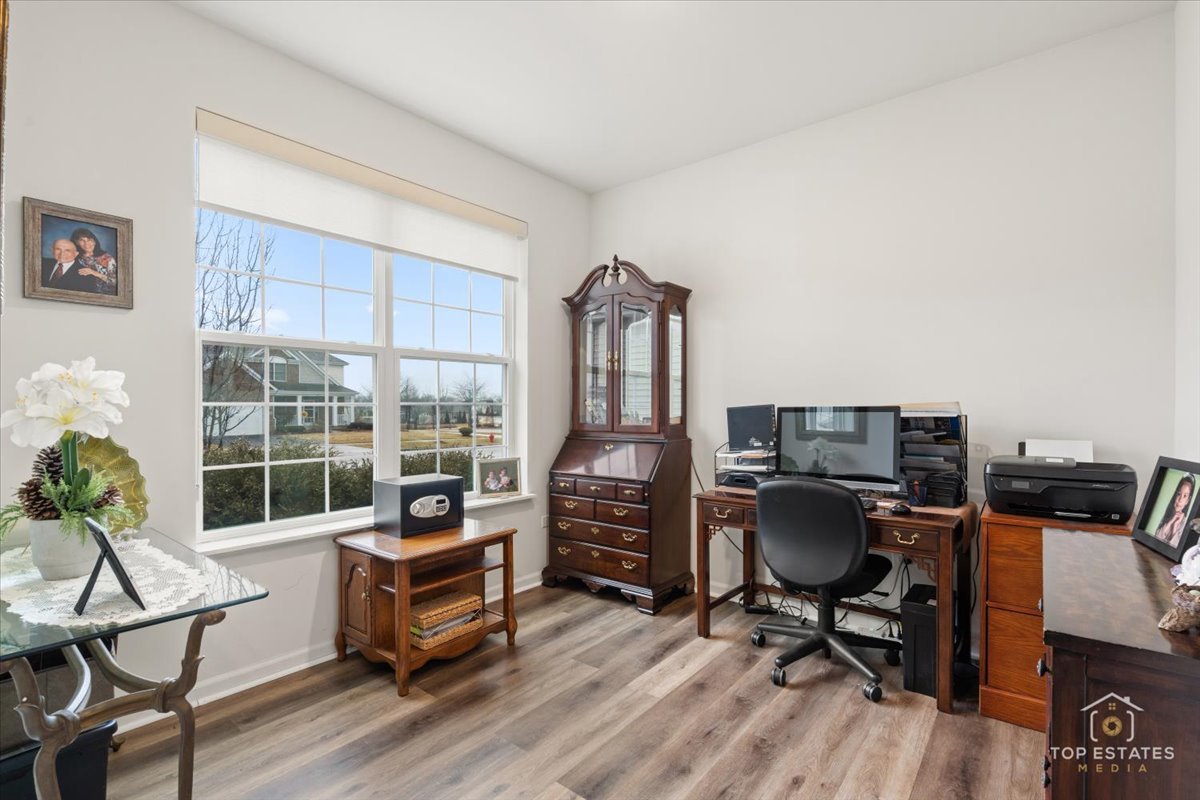 2010 Azure Lane Algonquin, IL 60102 - Photo 7 of 41 a work room with furniture and a floor to ceiling window