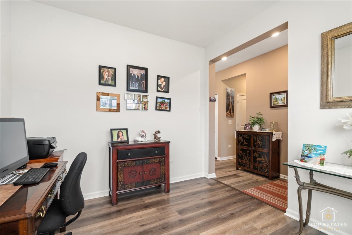 2010 Azure Lane Algonquin, IL 60102 - Photo 8 of 41 a view of a workspace with furniture and wooden floor