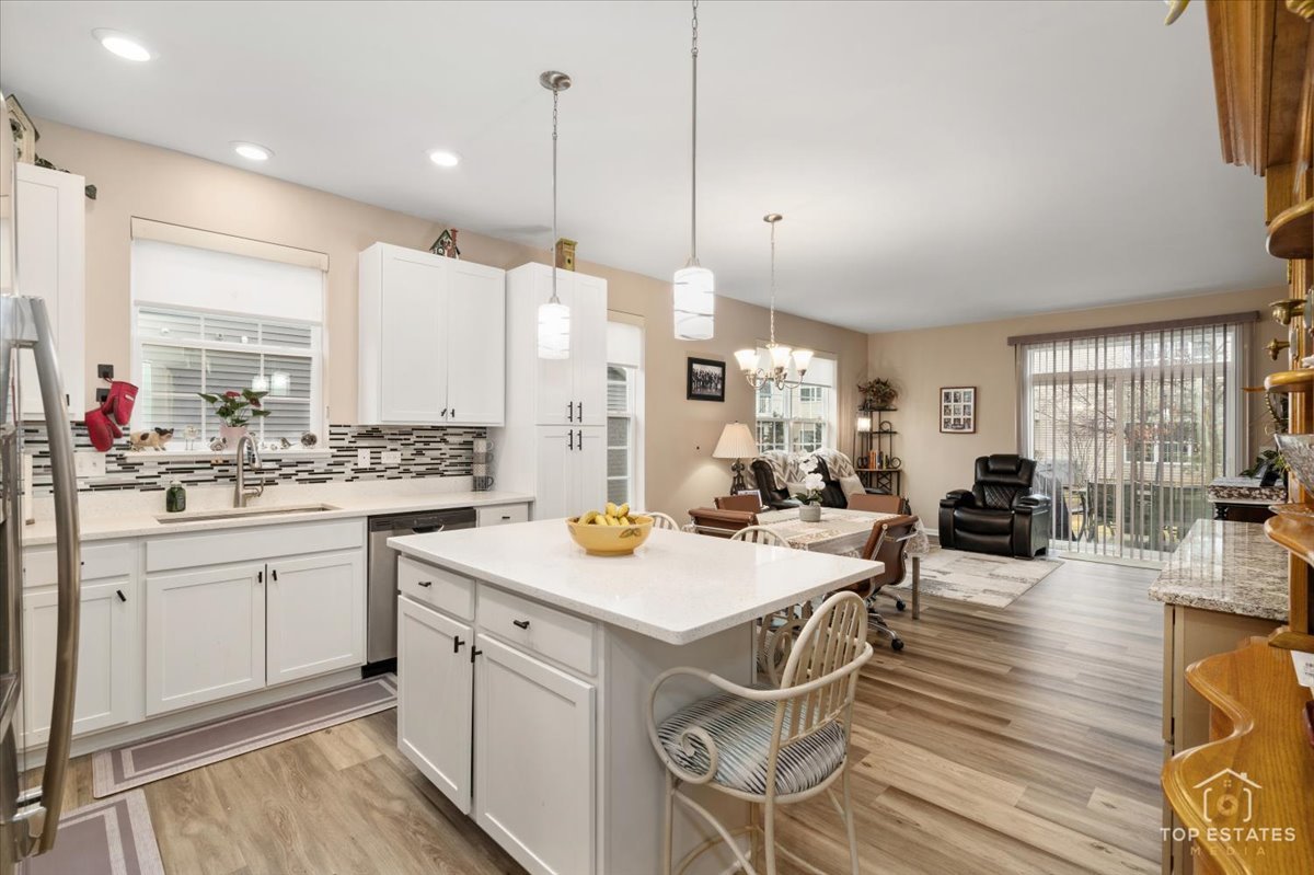 2010 Azure Lane Algonquin, IL 60102 - Photo 9 of 41 a open kitchen with sink cabinets and wooden floor