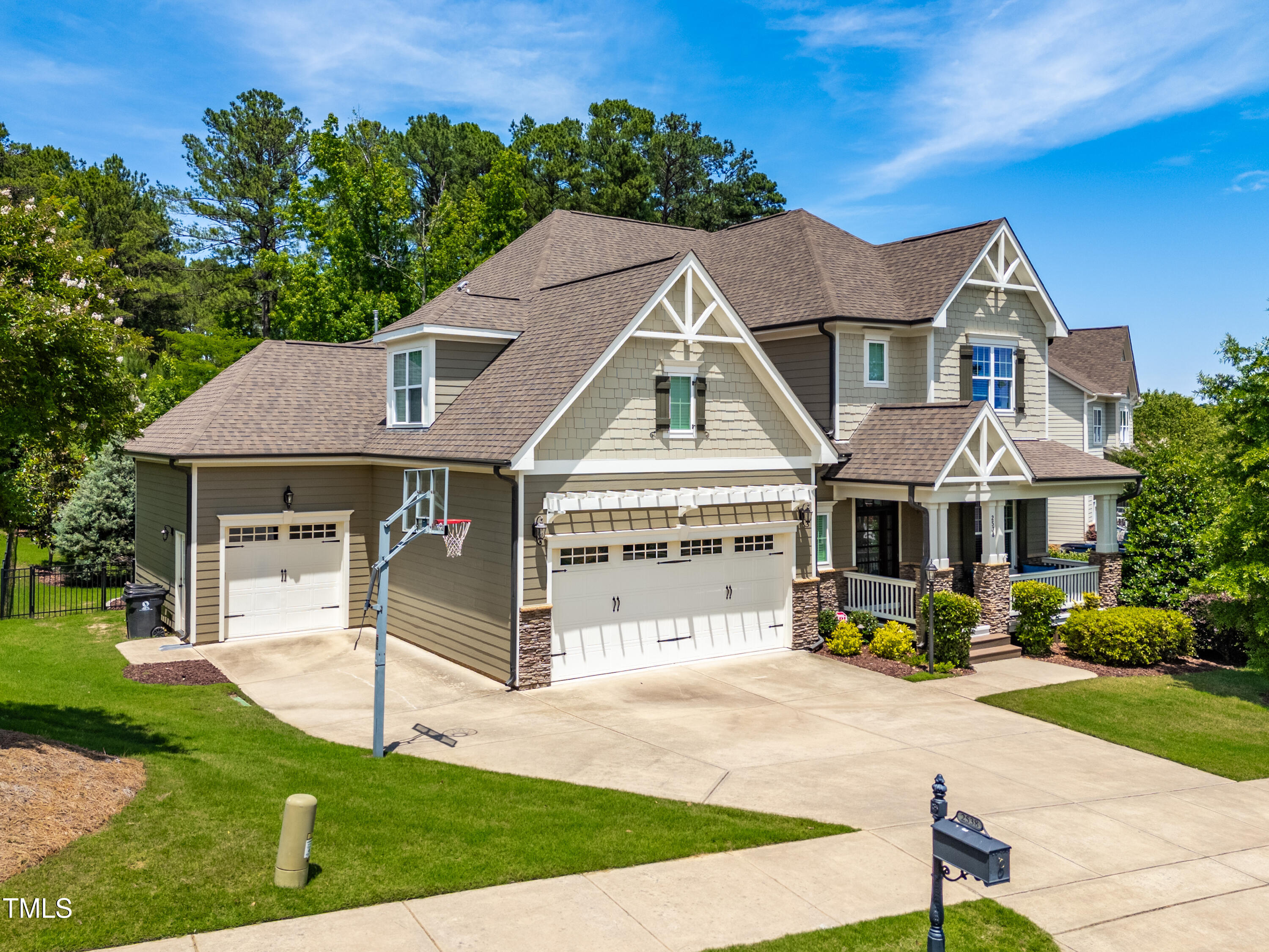 2538 Tuffeto Apex, NC 27502 - Photo 1 of 55 a front view of a house with a yard table and chairs