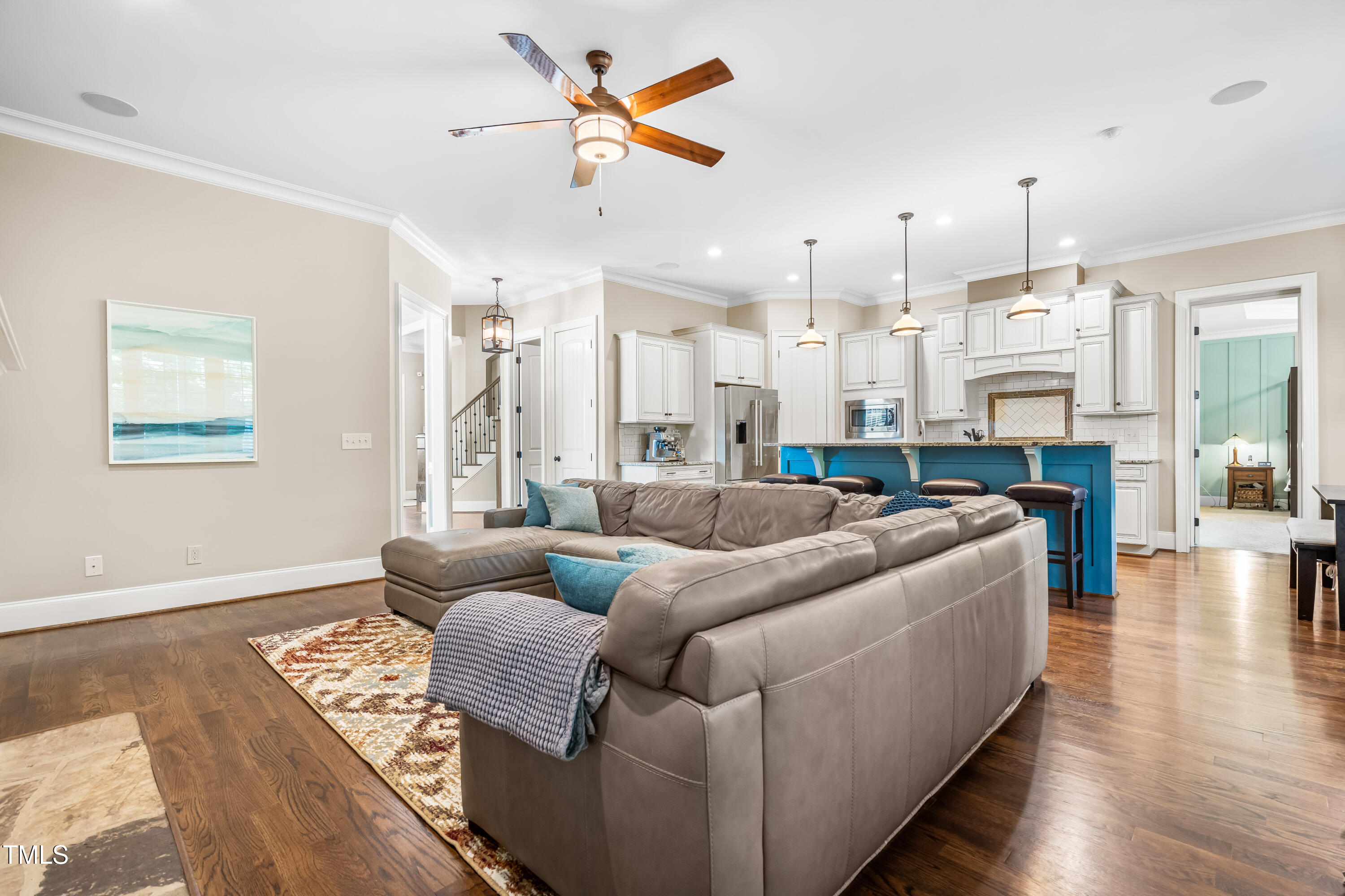 2538 Tuffeto Apex, NC 27502 - Photo 17 of 55 a living room with furniture fireplace and a chandelier